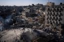 An Israeli strike destroyed residential buildings in Rafah (Fatima Shbair/AP)