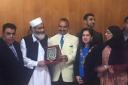 Siraj Ul Haq receiving an award in Waltham Forest town hall in 2016 (Cllr Liaquat Ali pictured left, Siraj Ul Haq right of him, Cllr Ahsan Khan stood behind 2016 mayor Cllr Saima Mahmud)