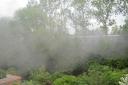 smoke from a train on the Epping to Onagr line descends on gardens in Bowes Drive, Ongar.