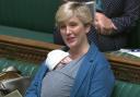Labour MP Stella Creasy speaking in the chamber of the House of Commons, in London, with her newborn baby strapped to her. Photo: PA Images