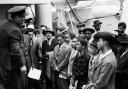 Jamaican immigrants welcomed by RAF officials from the Colonial Office after the ex-troopship HMT 'Empire Windrush' landed them at Tilbury (Image: PA)