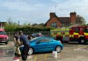 Firefighters at Loughton Fire Station hold a charity car wash