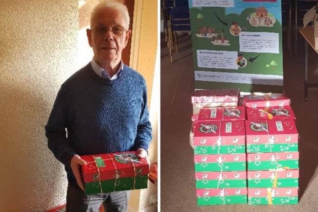 Club President Alan Glanville and some of the shoe boxes awaiting collection