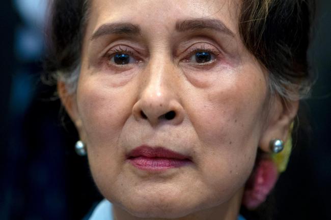 Myanmar’s leader Aung San Suu Kyi waits to address judges of the International Court of Justice on the second day of three days of hearings in The Hague, Netherlands on Dec. 11, 2019