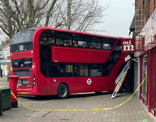 East London and West Essex Guardian Series: The bus crashed into a repairs shop with flats above. Credit: PA