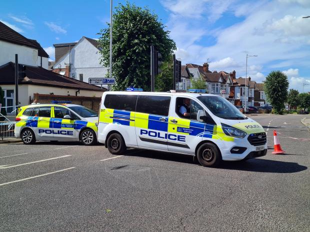 East London and West Essex Guardian Series: Police vehicles in Cranbrook Road. Credit: SWNS