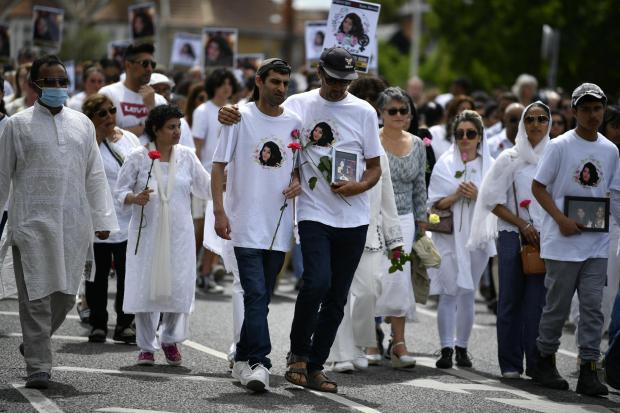 Family and friends with members of the public attend a vigil in Ilford in memory of Zara Aleena. Credit: PA
