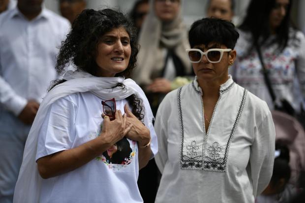 East London and West Essex Guardian Series: Aunt Farah Naz (left) and Anjum Mouj joins family and friends with members of the public to attend the vigil. Credit: PA
