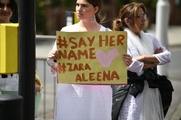 East London and West Essex Guardian Series: A woman holds a poster at the vigil that says 'Say her name, Zara Aleena'. Credit: PA