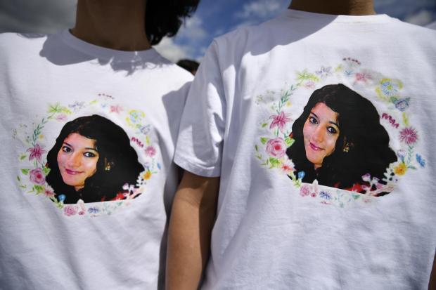 East London and West Essex Guardian Series: People wore t-shirts with Ms Aleena's face on. Credit: PA
