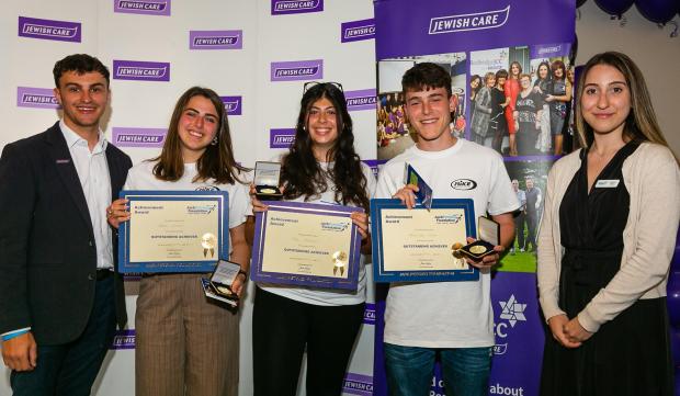 East London and West Essex Guardian Series: Winners of Jack Petchey Achievement Awards with Jessica Villiers from the foundation and Jamie Stone who is MIKE youth leadership co-ordinator. Credit: Yakir Zur