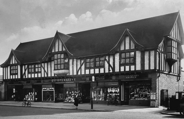 The Co-op building in Station Road, Chingford, c1938. It was built in around 1935 on the site of Tile House and the adjacent Richmond Road was planned at about the same time. The Co-op contained separate departments including grocers, butchers, drapers