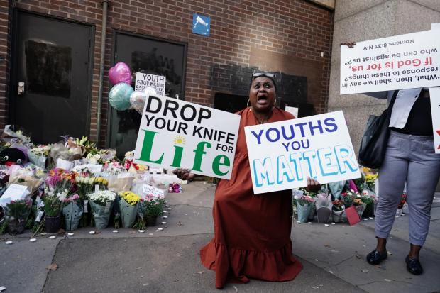 People protesting against knife crime at the scene in Croydon, south London, where 15-year-old Elianne Andam was stabbed to death this year