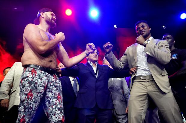 Tyson Fury (left) and Francis Ngannou (right) during a press conference (Image: PA)