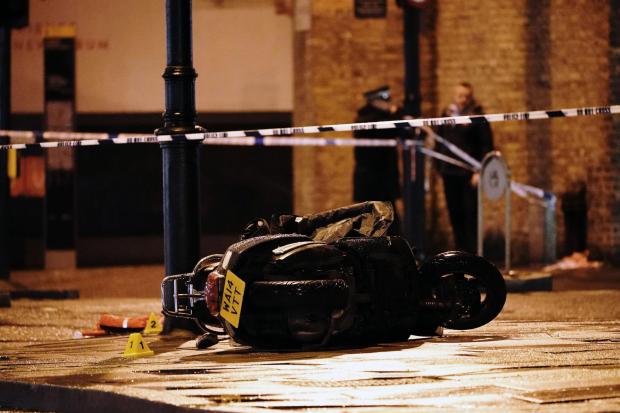 A police cordon at the scene of a shooting in Clapham, London where three people have been hurt after shots were fired by a moped rider who was being pursued by police (Aaron Chown/PA)