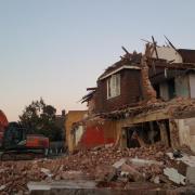 Bulldozers demolishing the former Royston Arms