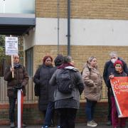 Eviction Resistance protestors stood outside a building in Vallentin Road, Wood Street, that they say contains several empty flats. Image: Josh Mellor/LDRS