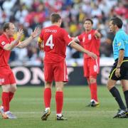 England's players surround the referee after Frank Lampard's 'goal' is ruled out