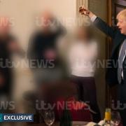 ITV handout photo dated 13/11/20 of a photograph obtained by ITV News of the Prime Minister raising a glass at a leaving party on 13th November 2020, with bottles of alcohol and party food on the table in front of him. Issue date: Monday May 23, 2022.
