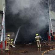 Firefighters at Chigwell Road Reuse and Recycling Centre. Image: London Fire Brigade
