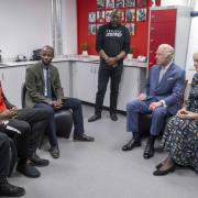 Omar Beckles (left) sat with Trevor Duberry, King Charles and Queen Consort Camilla. Credit: PA