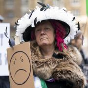 An activist dressed as a suffragette. Image: PA