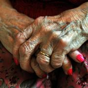 File photo dated 05/12/08 of hands of an elderly resident at a nursing home. Fewer than two thirds of adult social care services in England are deemed to be doing a good job of supporting people to live healthier lives, according to data said to reveal