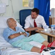 Jeremy Hunt checks up on a patient in an elderly ward visit