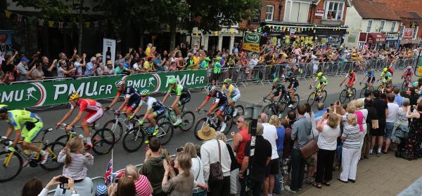Tour de France riders come through Epping High Street
