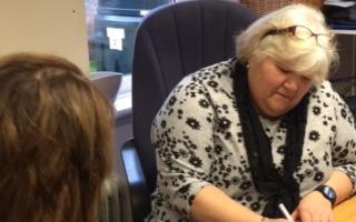Jina Symes, head of VAEF Benefits Advice and Guidance, helps a client (Image: VAEF)